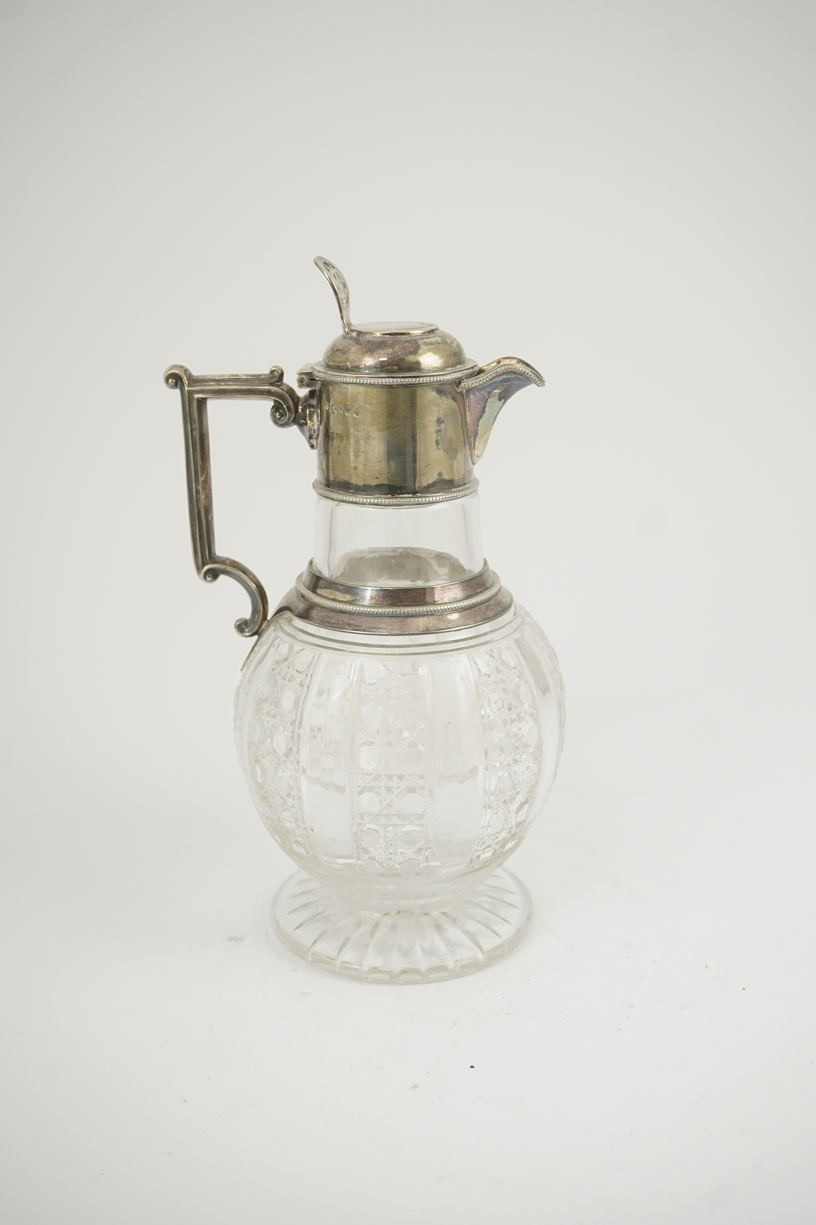 A late Victorian silver mounted cut glass claret jug, by Edward Hutton